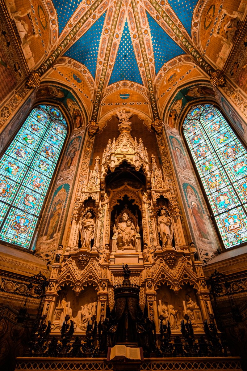 Ornate cathedral interior with stained glass windows and intricate architecture